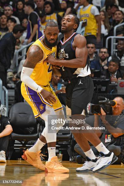 LeBron James of the Los Angeles Lakers and Kawhi Leonard of the LA Clippers battle for position during the game on November 1, 2023 at Crypto.Com...