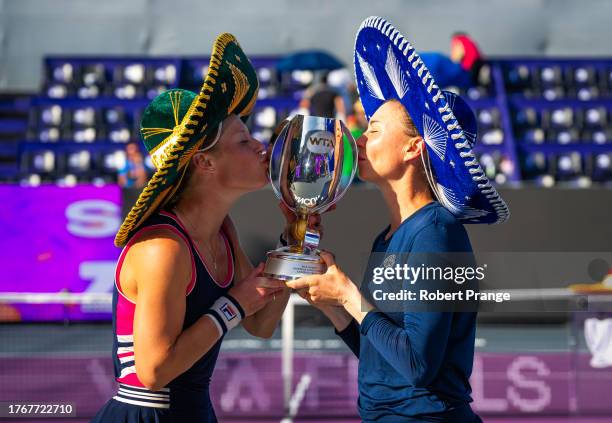 Laura Siegemund of Germany and Vera Zvonareva pose with their champions trophy after defeating Nicole Melichar-Martinez of the United States and...