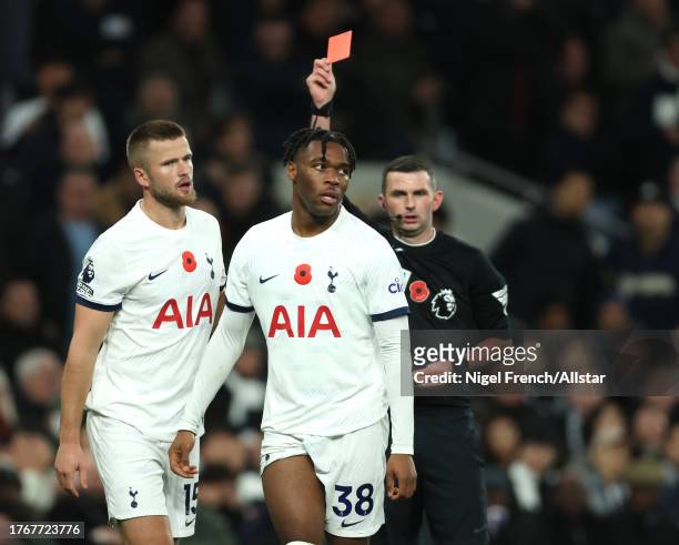 Destiny Udogie of Tottenham Hotspur receives a red card from referee Michael Oliver during the Premier League match between Tottenham Hotspur and...
