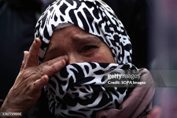 Muslim woman gets emotional during the Pro-Palestine demonstration at Place de Nation. Hundreds of thousands of people marched in several cities in...