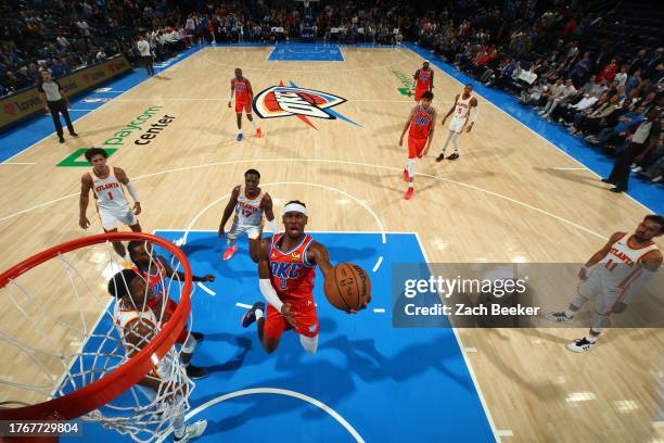 Shai Gilgeous-Alexander of the Oklahoma City Thunder drives to the basket during the game against the Atlanta Hawks on November 6, 2023 at Paycom...