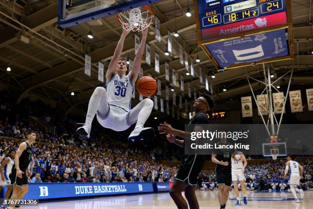 Kyle Filipowski of the Duke Blue Devils dunks the ball during the second half of the game against the Dartmouth Big Green at Cameron Indoor Stadium...