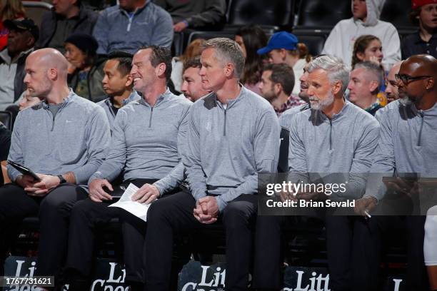 The Golden State Warriors coaching staff look on during the game against the Detroit Pistons on November 6, 2023 at Little Caesars Arena in Detroit,...