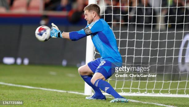 Zac MacMath of Real Salt Lake makes a save on an overtime penalty kick by Amine Bassi of the Houston Dynamo during their MLS Cup Western conference...
