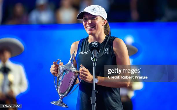 Iga Swiatek of Poland during the trophy ceremony after defeating Jessica Pegula of the United States in the final of the GNP Seguros WTA Finals...