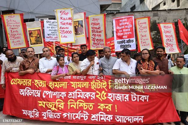 Members from various garment workers' unions take part in a protest in front of the Minimum Wage Board office in Dhaka on November 7, 2023. Police...