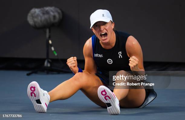 Iga Swiatek of Poland reacts to defeating Jessica Pegula of the United States in the final of the GNP Seguros WTA Finals Cancun 2023 part of the...