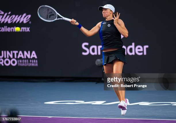 Iga Swiatek of Poland in action against Jessica Pegula of the United States in the final of the GNP Seguros WTA Finals Cancun 2023 part of the...