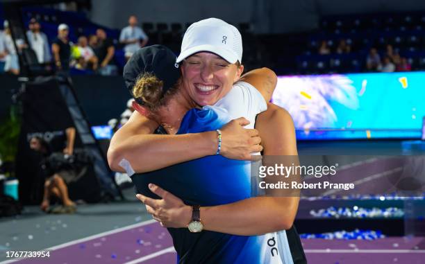 Iga Swiatek of Poland hugs Daria Abramowicz after defeating Jessica Pegula of the United States in the final of the GNP Seguros WTA Finals Cancun...