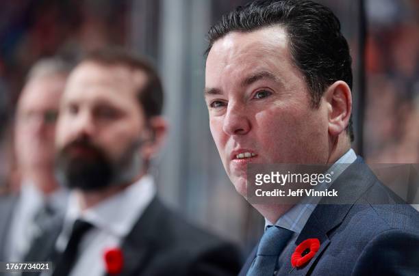 Head coach Jay Woodcroft of the Edmonton Oilers looks on from the bench during the third period of their NHL game against the Vancouver Canucks at...