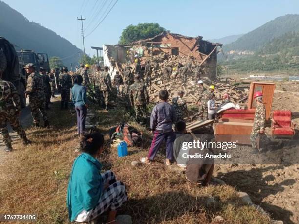 Members of Nepali Army Rescue Team carry an injured civilian from the earthquake affected area at Jajarkot district of Nepal on November 07, 2023....