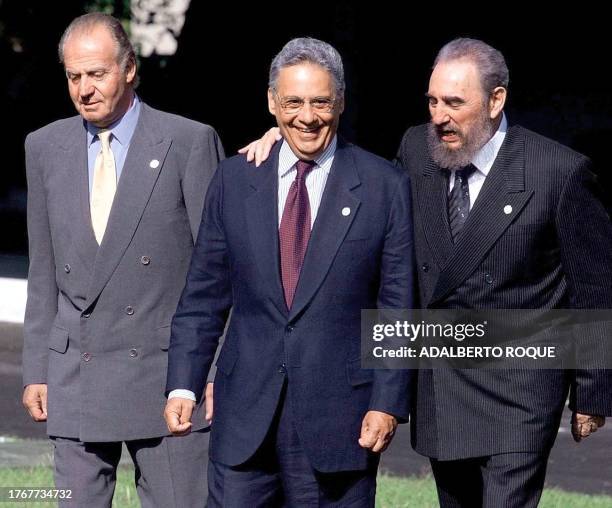 Brazilian President Fernando Henrique Cardoso is flanked by his Cuban counterpart Fidel Castro and Spain's King Juan Carlos as they prepare for the...