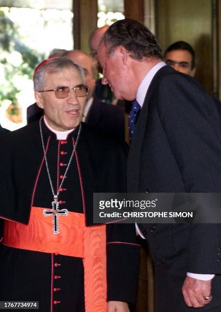 Spain King Juan Carlos talks to Spanish Cardinal Antonio Maria Rouco Varela at an episcopal conference in Madrid 20 November 2001. AFP PHOTO...