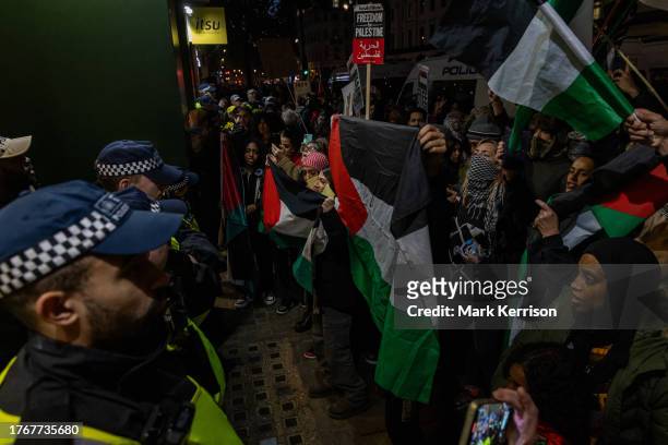 Pro-Palestinian activists are pictured outside a branch of burger chain McDonald's following a sit-down protest inside Charing Cross railway station...