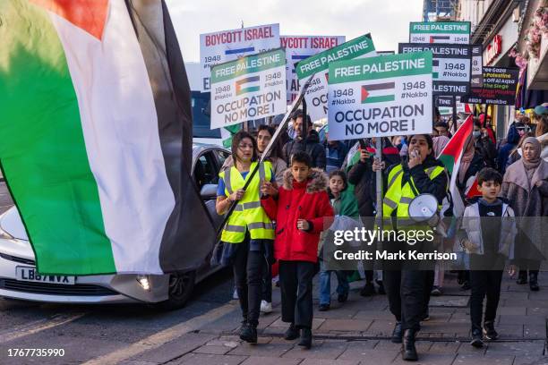 Pro-Palestinian activists from Palestine Solidarity Campaign march to call for an immediate ceasefire in Gaza on 5th November 2023 in Windsor, United...