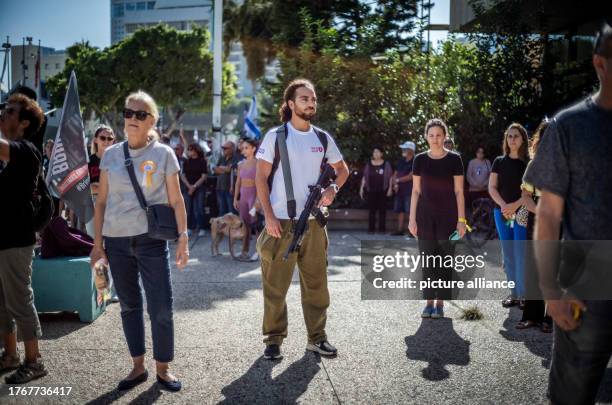 November 2023, Israel, Tel Aviv: Israelis stand for a minute of silence to mark one month since the deadly attack by the Palestinian group Hamas on...