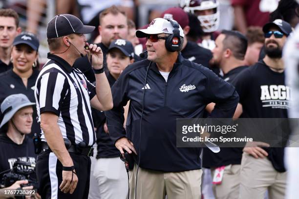 Texas A&M Aggies head coach Jimbo Fisher talks to an official on the sideline during a college football game against the South Carolina Gamecocks on...