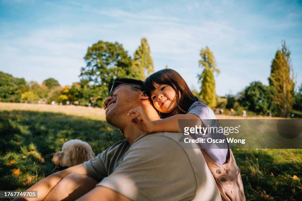 young asian father and daughter spending quality time together - nepal celebrates kuse aunsi or fathers day for departed souls stock pictures, royalty-free photos & images