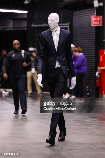 Victor Wembanyama of the San Antonio Spurs arrives in a Slenderman costume before an NBA game against the Phoenix Suns at Footprint Center on October...