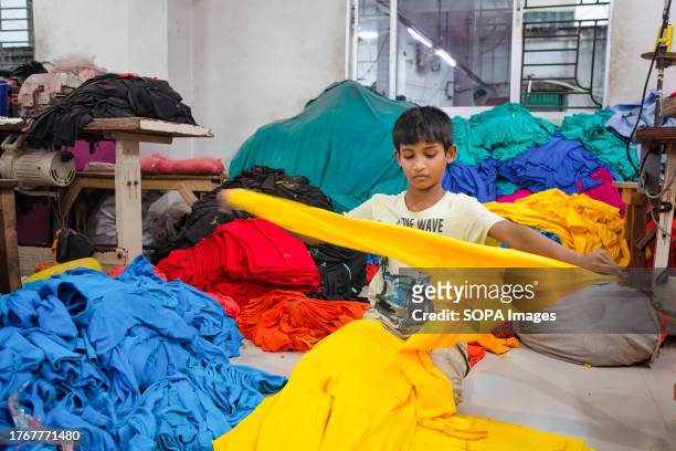Child seen working at a local ready made garment factory. Child labor is restricted in ready-made garment sectors. However, there are still children...