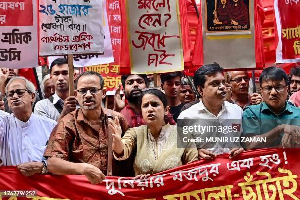 Garment workers and activists take part in a protest in Dhaka on November 7, 2023. Police fired tear gas at thousands of workers who set a bus on...