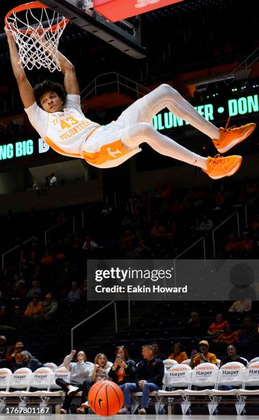 Cameron Carr of the Tennessee Volunteers dunks in the second half of the game against the Lenoir-Rhyne Bears at Thompson-Boling Arena on October 31,...