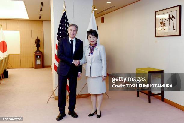 Secretary of State Antony Blinken shakes hands with Japanese Foreign Minister Yoko Kamikawa prior to their bilateral meeting at the Ministry of...