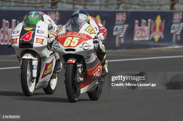 Phillip Oettl of Germany and Paddock TT Emotion Event leads Francesco Bagnaia of Italy and San Carlo Team Italia FMI during the Moto3 race during the...