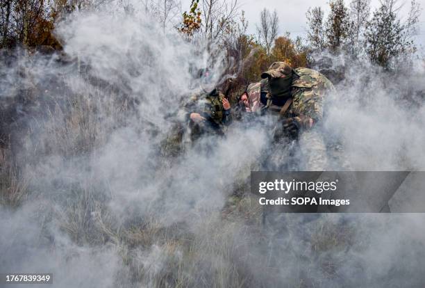 Participants of the military training for the civilian population learn to provide first aid in case of injury and practice the evacuation of the...