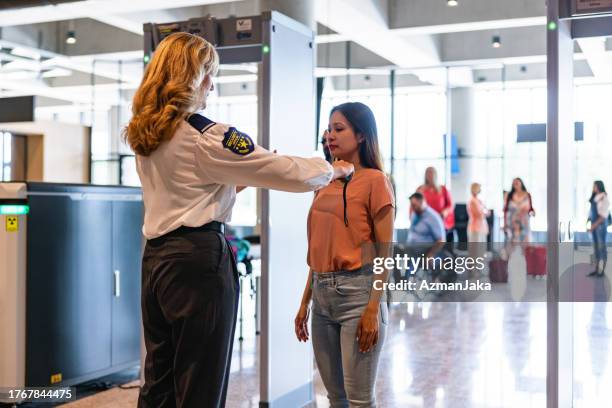 airport security screening: friendly staff ensuring safety - indian tour guide stock pictures, royalty-free photos & images