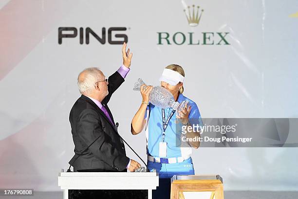John Solheim, CEO of Ping, presents the Solheim Cup to captain Liselotte Neumann of the European Team after they defeated the United States Team...