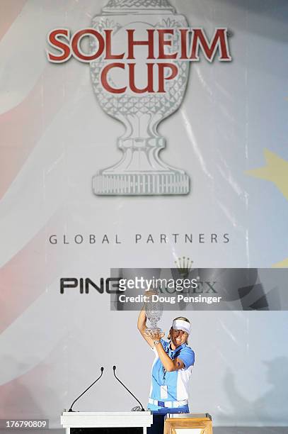 Captain Liselotte Neumann of the European Team hoists the Solheim Cup after they defeated the United States Team 18-10 in the 2013 Solheim Cup on...