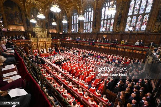 King Charles III delivers a speech beside Queen Camilla during the State Opening of Parliament in the House of Lords Chamber, on November 7, 2023 in...