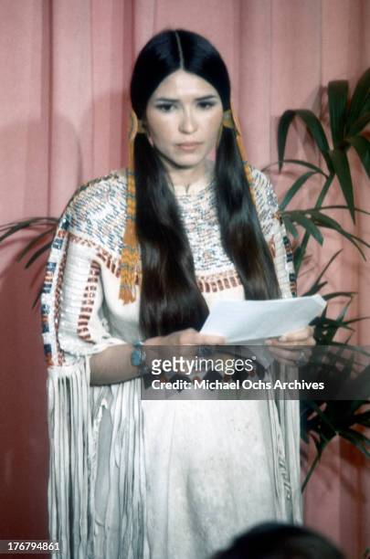March 27 - LOS ANGELES: Sacheen Littlefeather holds a written statement from actor Marlon Brando refusing his Best Actor Oscar on stage at the...