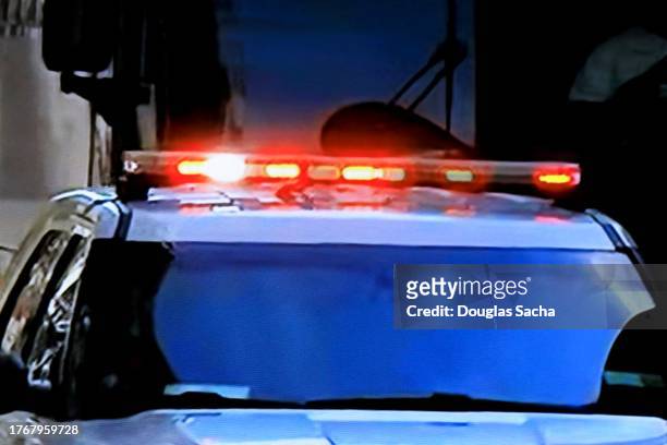 flashing police lights on a law enforcement vehicle - vehicle light fotografías e imágenes de stock