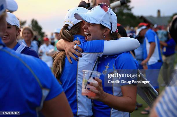 Beatriz Recari of Spain and the European Team celebrates with her teammates after defeating the United States Team in the 2013 Solheim Cup on August...