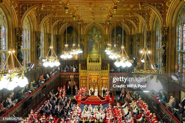 Britain's King Charles III sits besides Queen Camilla during the State Opening of Parliament at the Houses of Parliament on November 7, 2023 in...