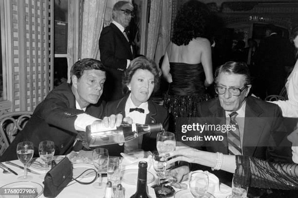 Louis Jourdan, Berthe Jourdan, and Fred de Cordova attend a party at the Bistro restaurant in Beverly Hills, California, on March 29, 1982.