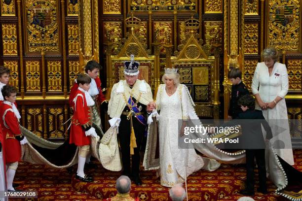 Britain's King Charles III sits besides Queen Camilla during the State Opening of Parliament at the Houses of Parliament on November 7, 2023 in...