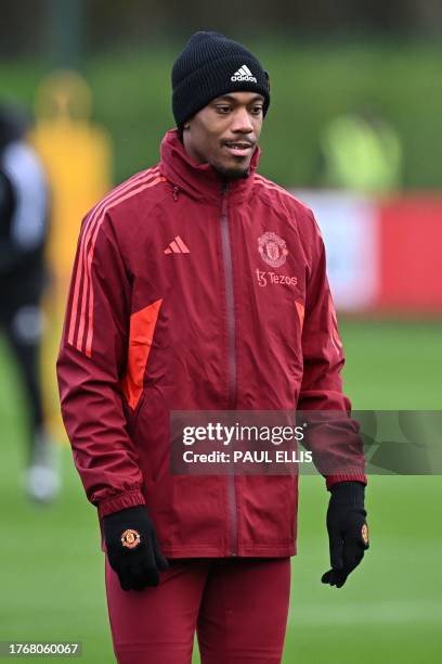 Manchester United's French striker Anthony Martial takes part with teammates in a training session at the Carrington Training Complex in Manchester,...