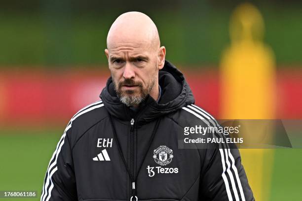 Manchester United's Dutch manager Erik ten Hag takes a training session at the Carrington Training Complex in Manchester, north-west England on...