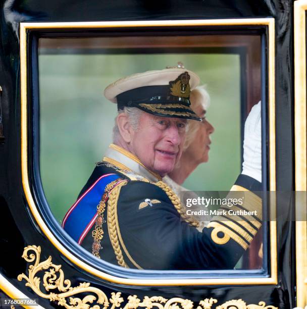 King Charles III and Queen Camilla travel down The Mall in a horse drawn carriage after the State Opening of Parliament on November 7, 2023 in...
