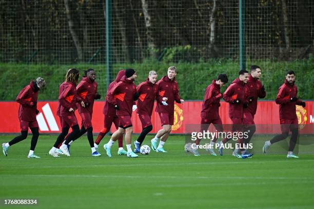 Manchester United's players take part in a training session at the Carrington Training Complex in Manchester, north-west England on November 7, 2023...