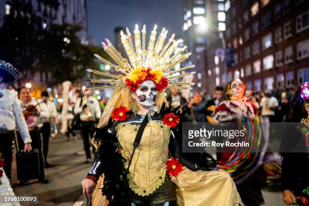 Parade participant is seen in a traditional "Día de Muertos" costume during the Village Halloween Parade in Manhattan on October 31, 2023 in New York...