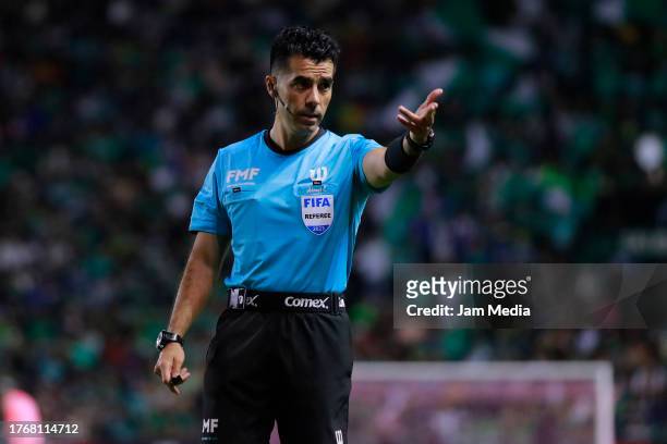 Adonai Escobedo, central referee, gestures during the 15th round match between Leon and Pumas UNAM as part of the Torneo Apertura 2023 Liga MX at...