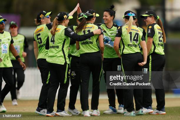 Marizanne Kapp of the Thunder celebrates the dismissal of Hayley Matthews of the Renegades during the WBBL match between Melbourne Renegades and...