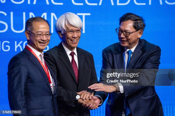From Left to Right Current Chief Executive of the Hong Kong Monetary Authority, Eddie Yue Wai-man, Former Chief Executive of the Hong Kong Monetary...