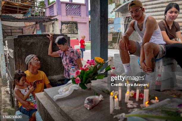 Filipinos visit the graves of departed loved ones as they mark All Saints' Day at Manila North Cemetery on November 01, 2023 in Manila, Philippines....