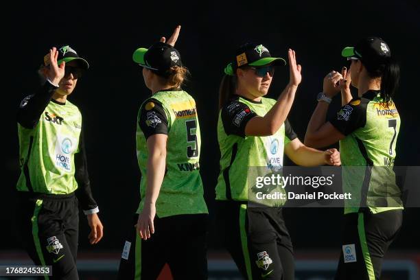 The Thunder celebrate winning the WBBL match between Melbourne Renegades and Sydney Thunder at CitiPower Centre, on November 01 in Melbourne,...