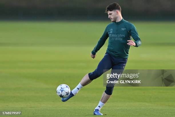 Arsenal's English midfielder Declan Rice attends a team training session at Arsenal's training ground in north London on November 7 on the eve of...